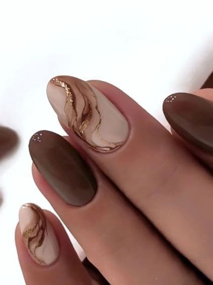 dark brown nails with marble accents