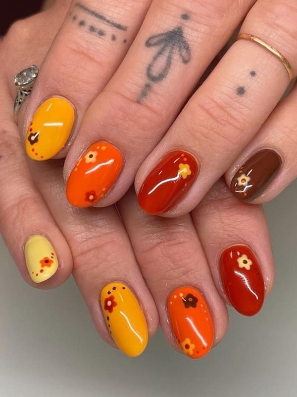 burnt orange nails with cute flowers
